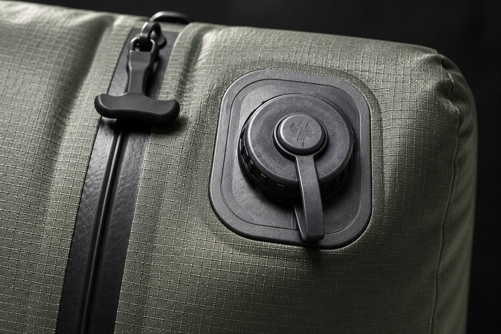Close-up of the one-way valve on a compression bag